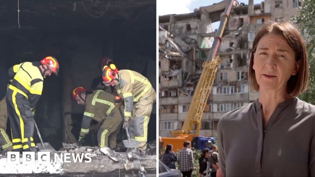 Russian attack leaves gaping hole in Kyiv residential building