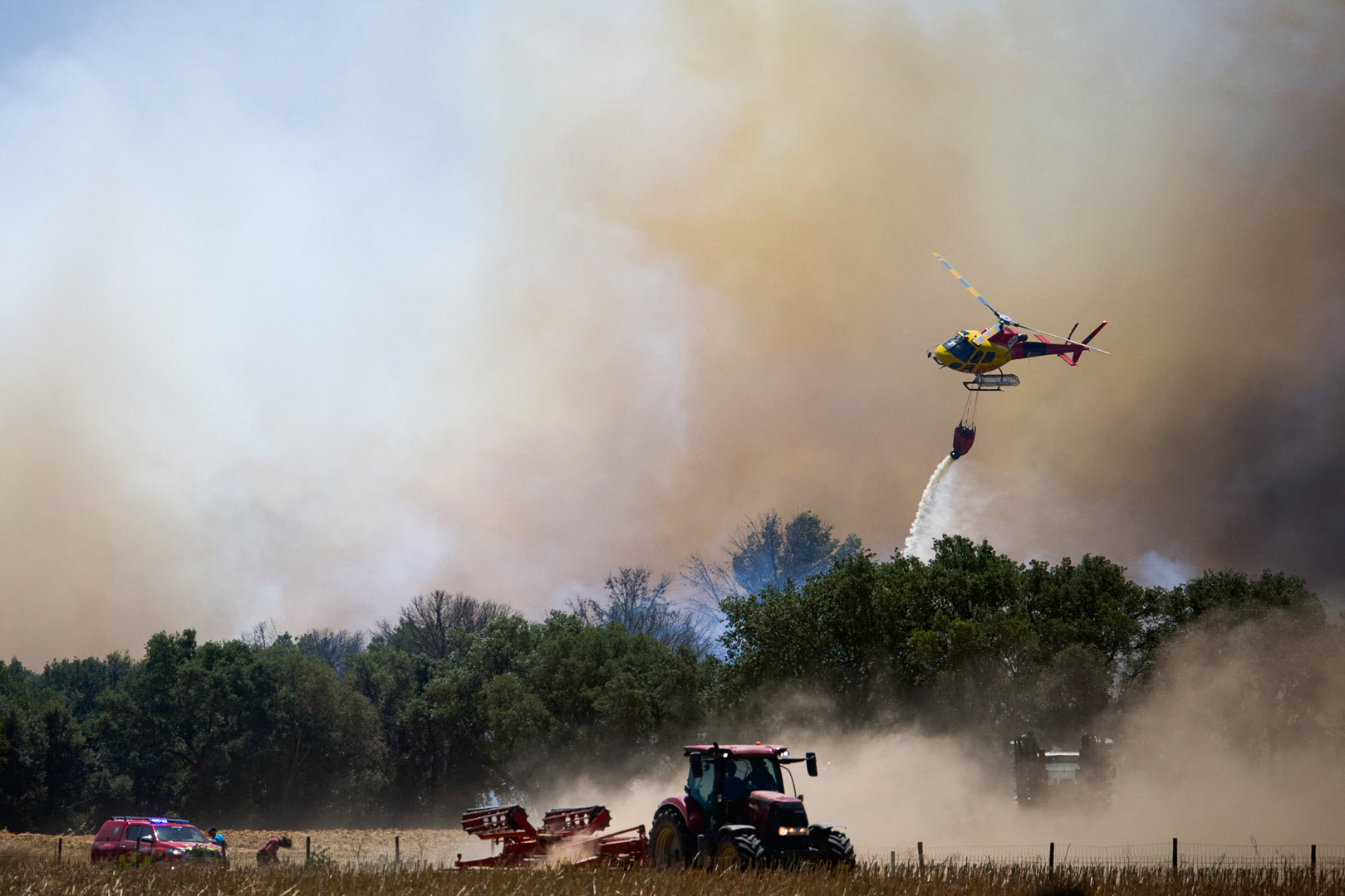 Firefighters race to contain flames in northeastern Spain
