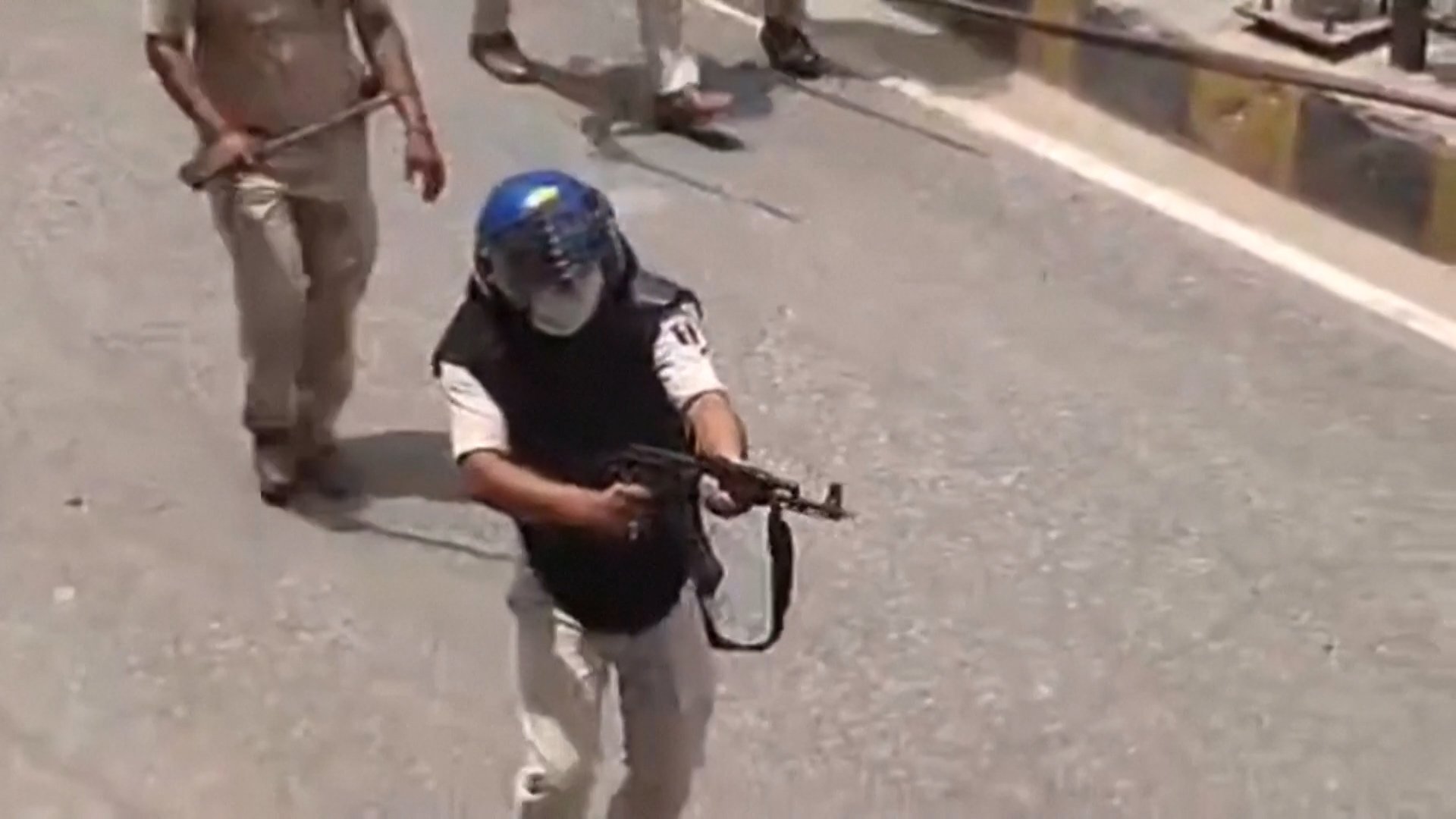 India suspends police officer for firing AK-47 at student protesters