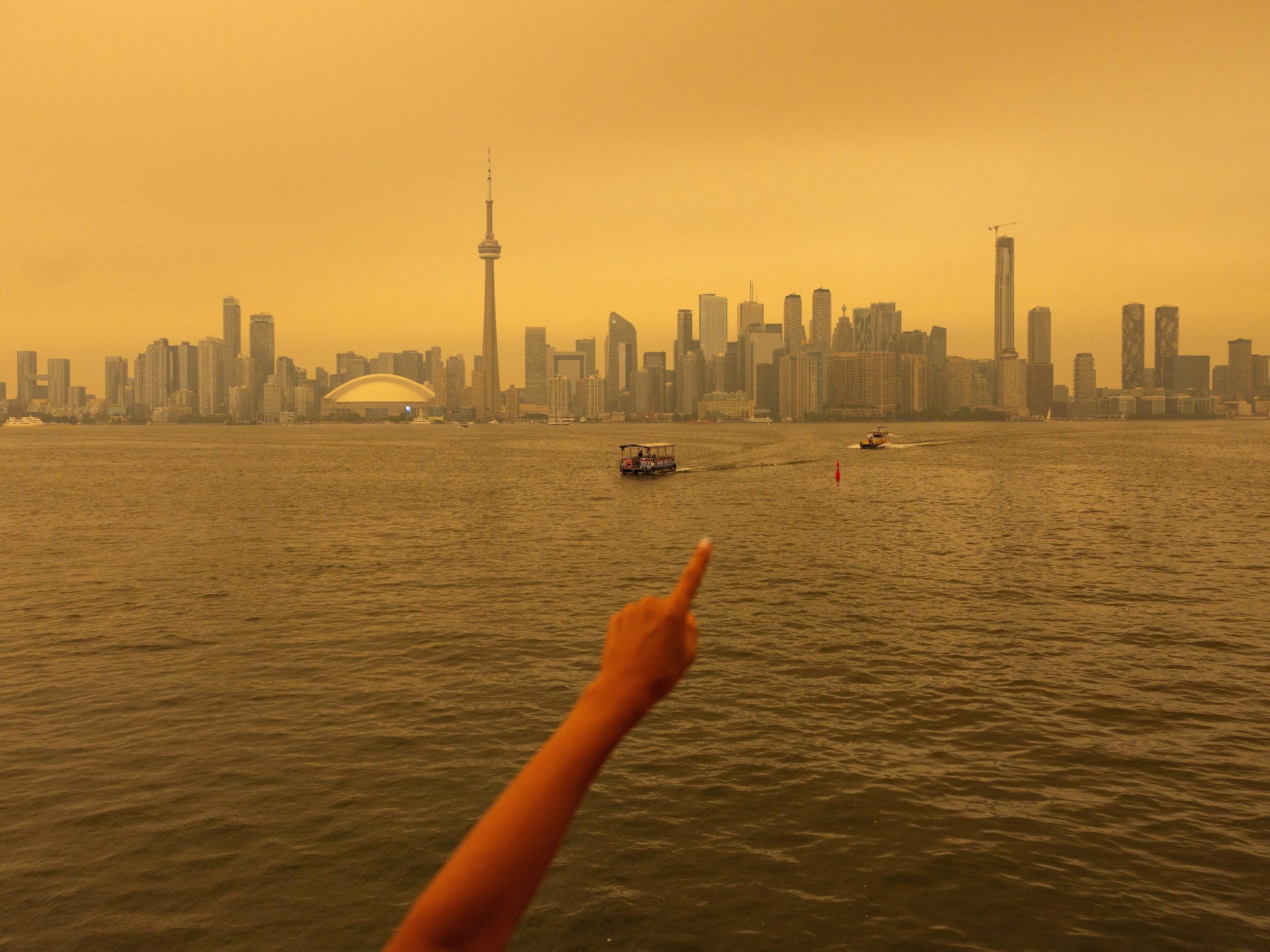 Toronto engulfed by wildfire smoke as US cities threatened