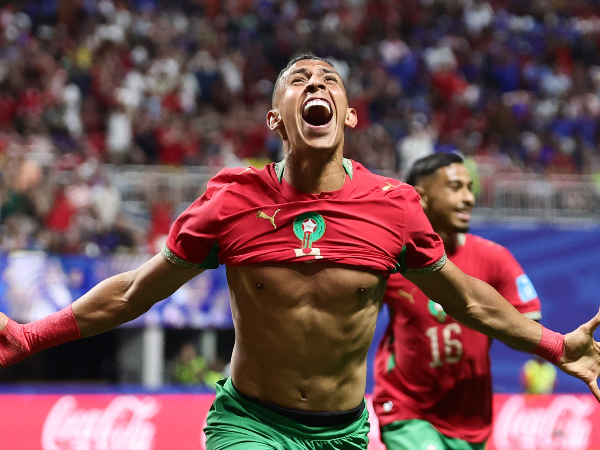 Morocco come back after historic Haiti goals to reach World Cup last 32