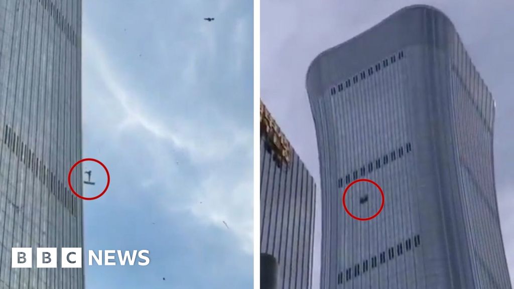 Debris falls after plane hits Beijing's tallest building