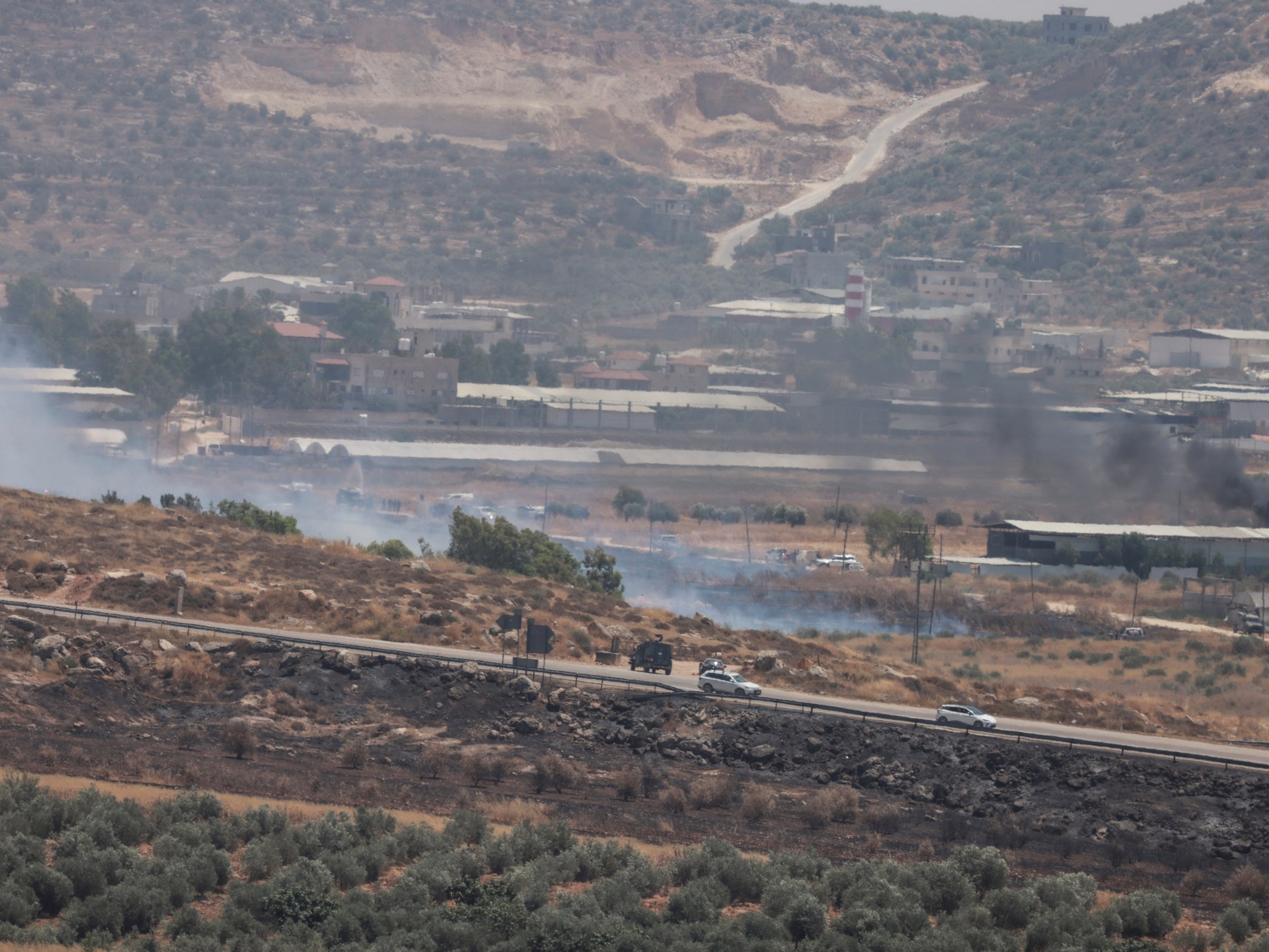 Two Palestinians shot dead by Israeli forces as West Bank fields set ablaze