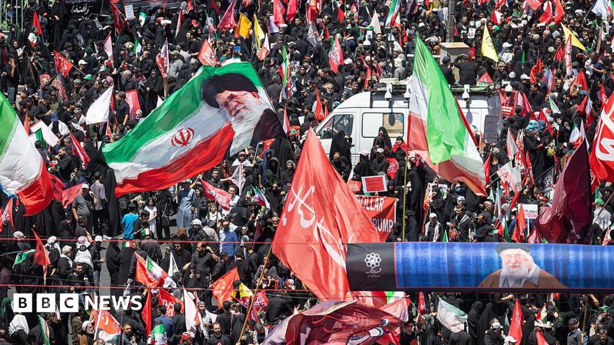 Huge crowds in Mashhad as Iran's late supreme leader is buried