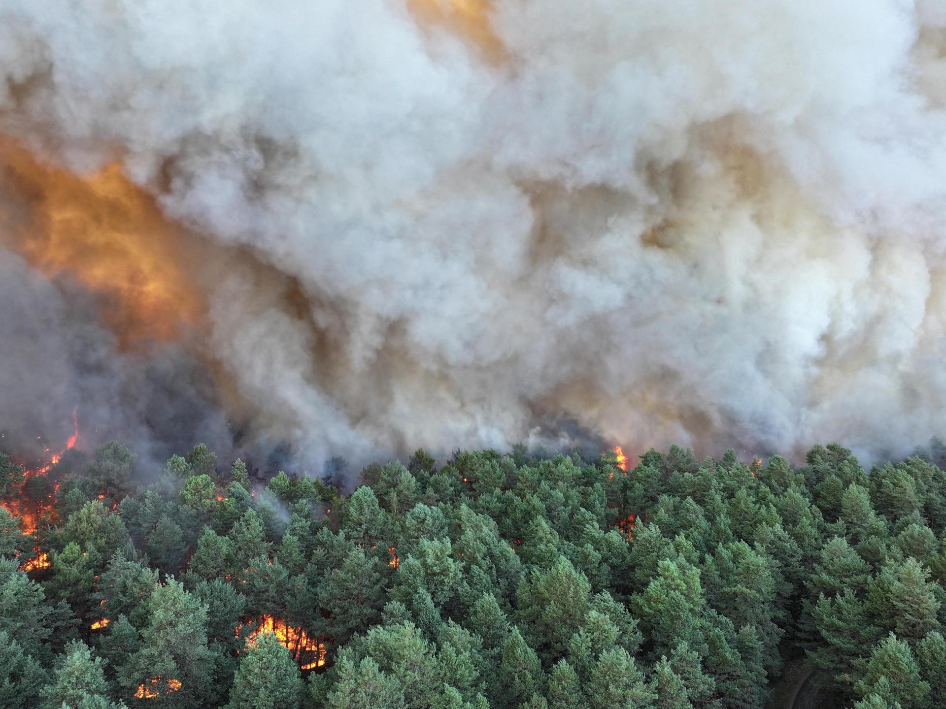 Wildfires near Paris force evacuations, disrupt train lines and motorway