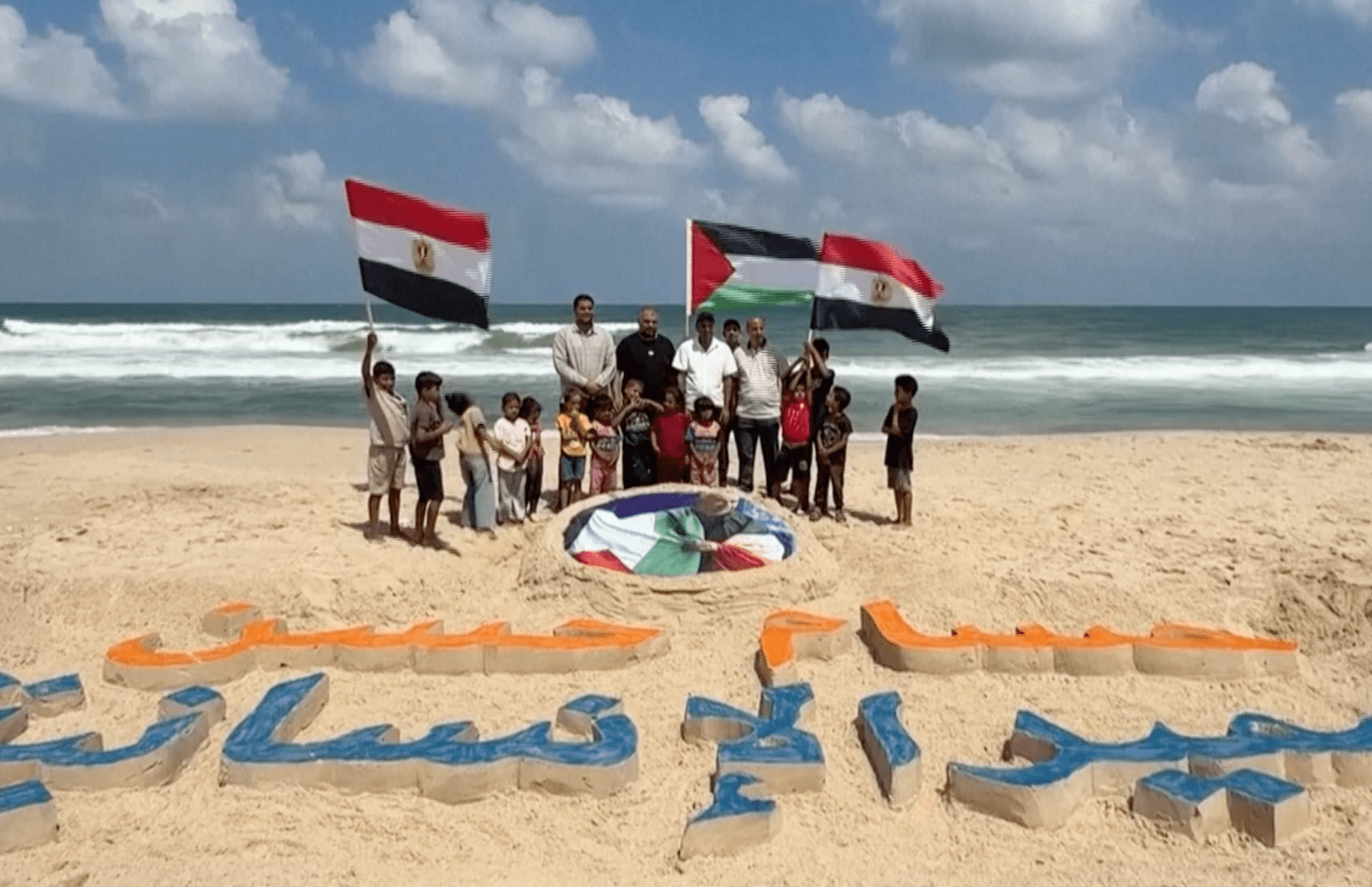 Gaza artists honour Egypt coach Hossam Hassan with sand portrait
