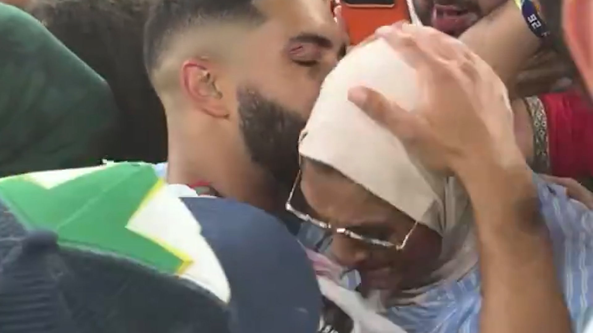 Morocco player hugs mother as team celebrates win against Netherlands