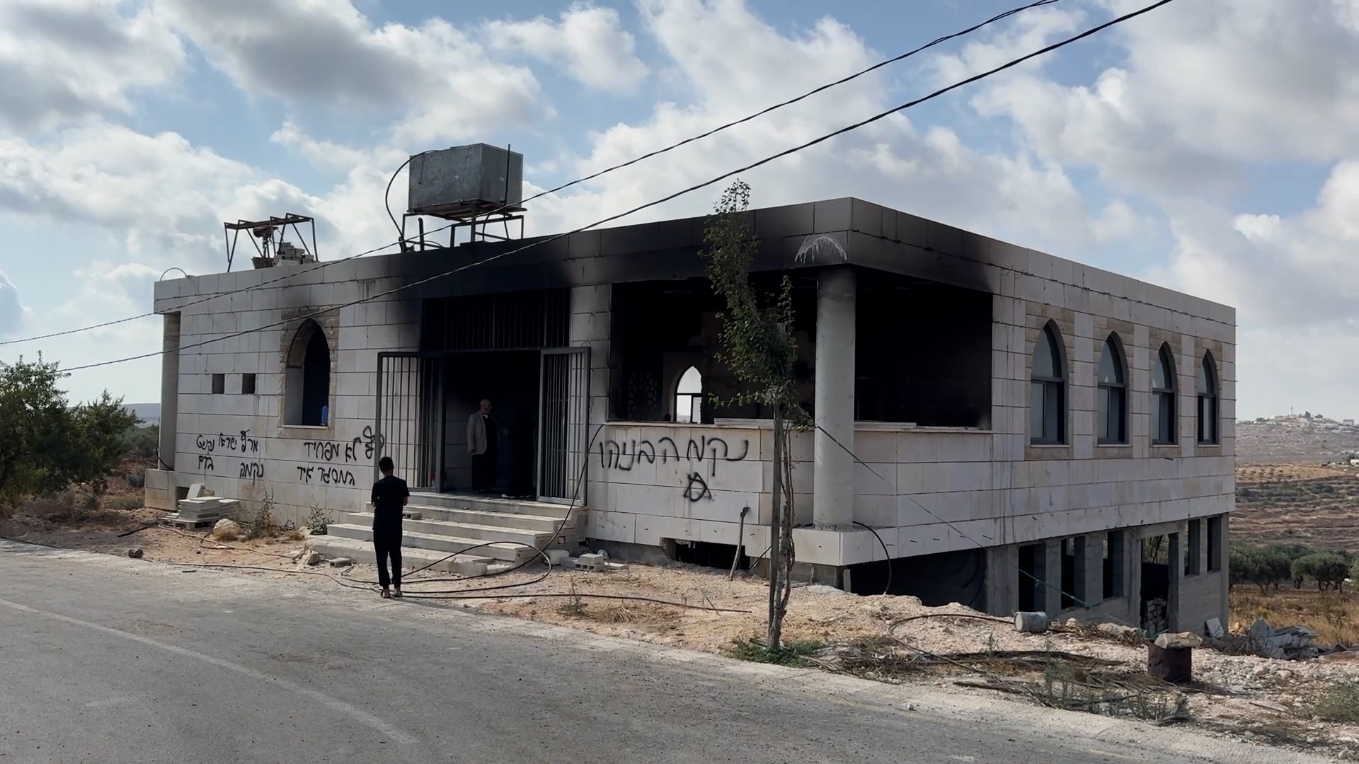 Israeli settlers burn two mosques in occupied West Bank