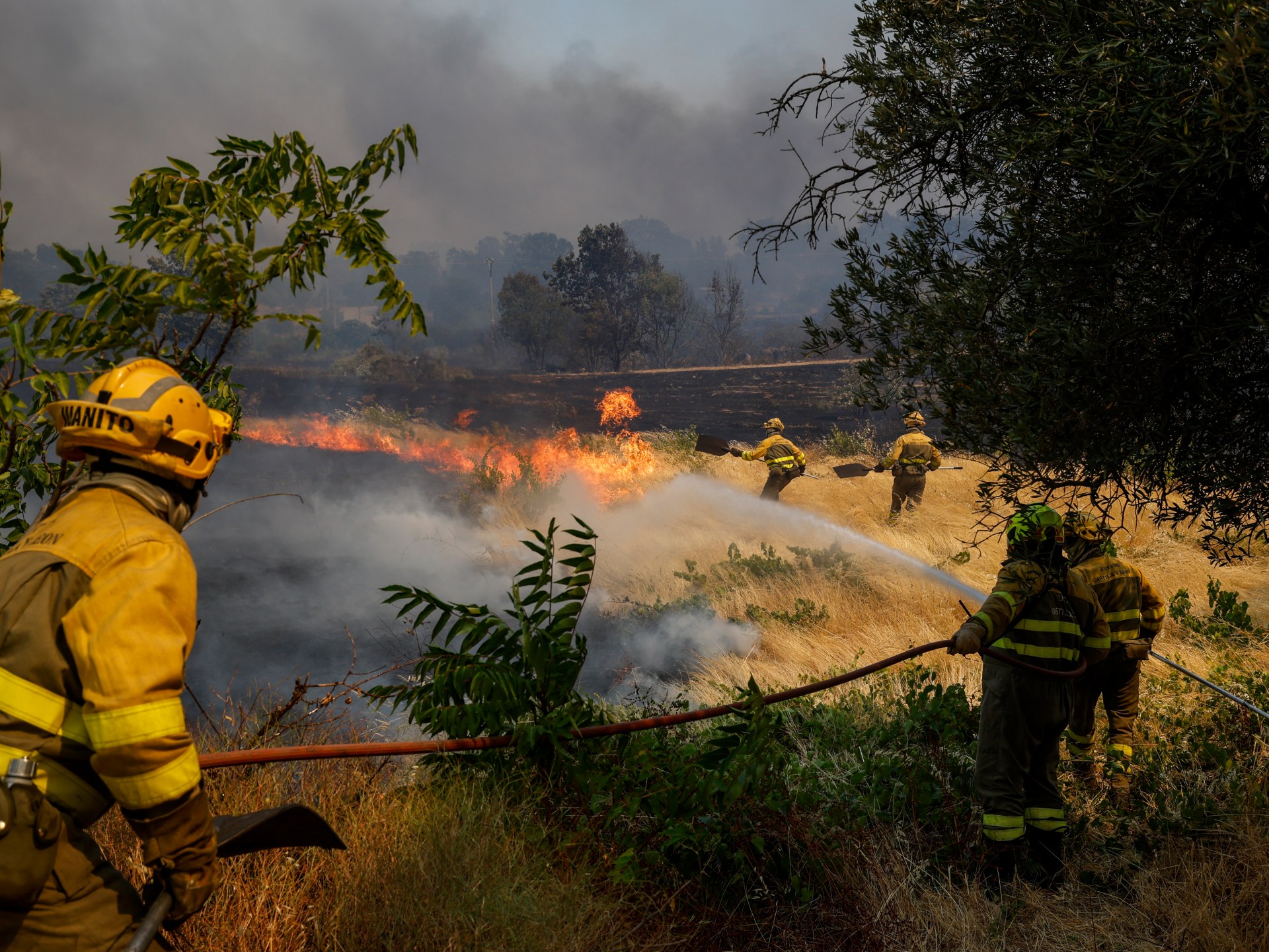 Spanish police accuse tractor driver of sparking wildfire as blazes spread