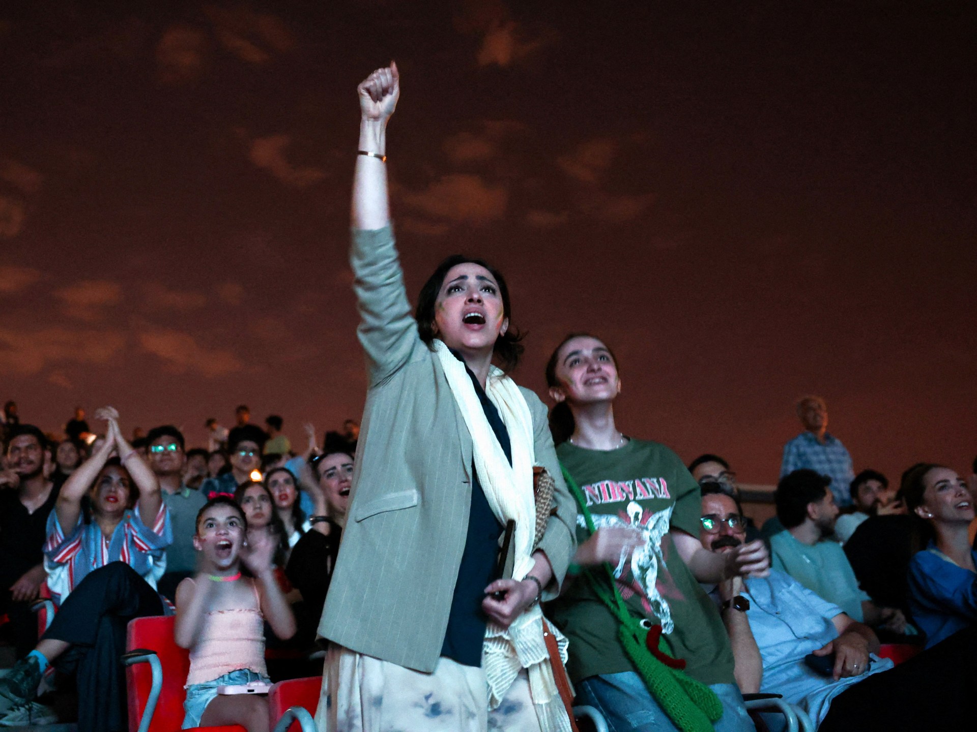 Iranians gather in Tehran to support team in critical draw against Belgium