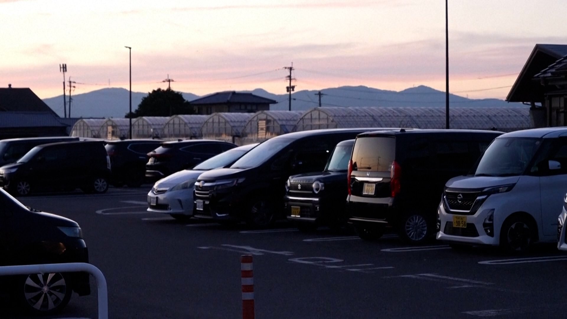 Families sleep in cars after homes destroyed in Japan earthquake