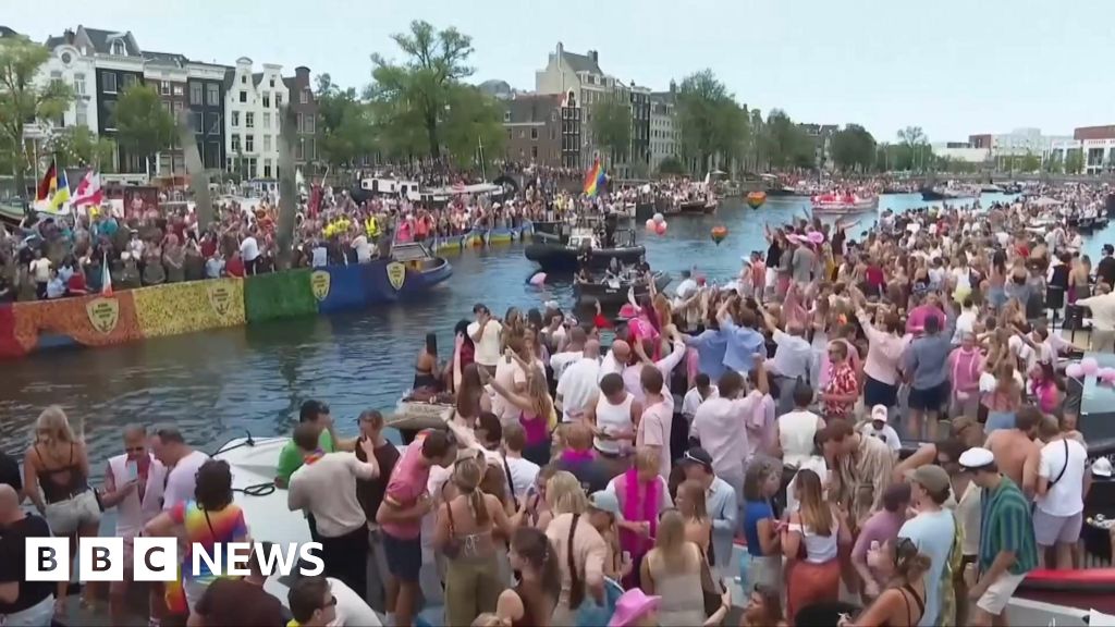 Crowds line Amsterdam's canals for Pride boat parade