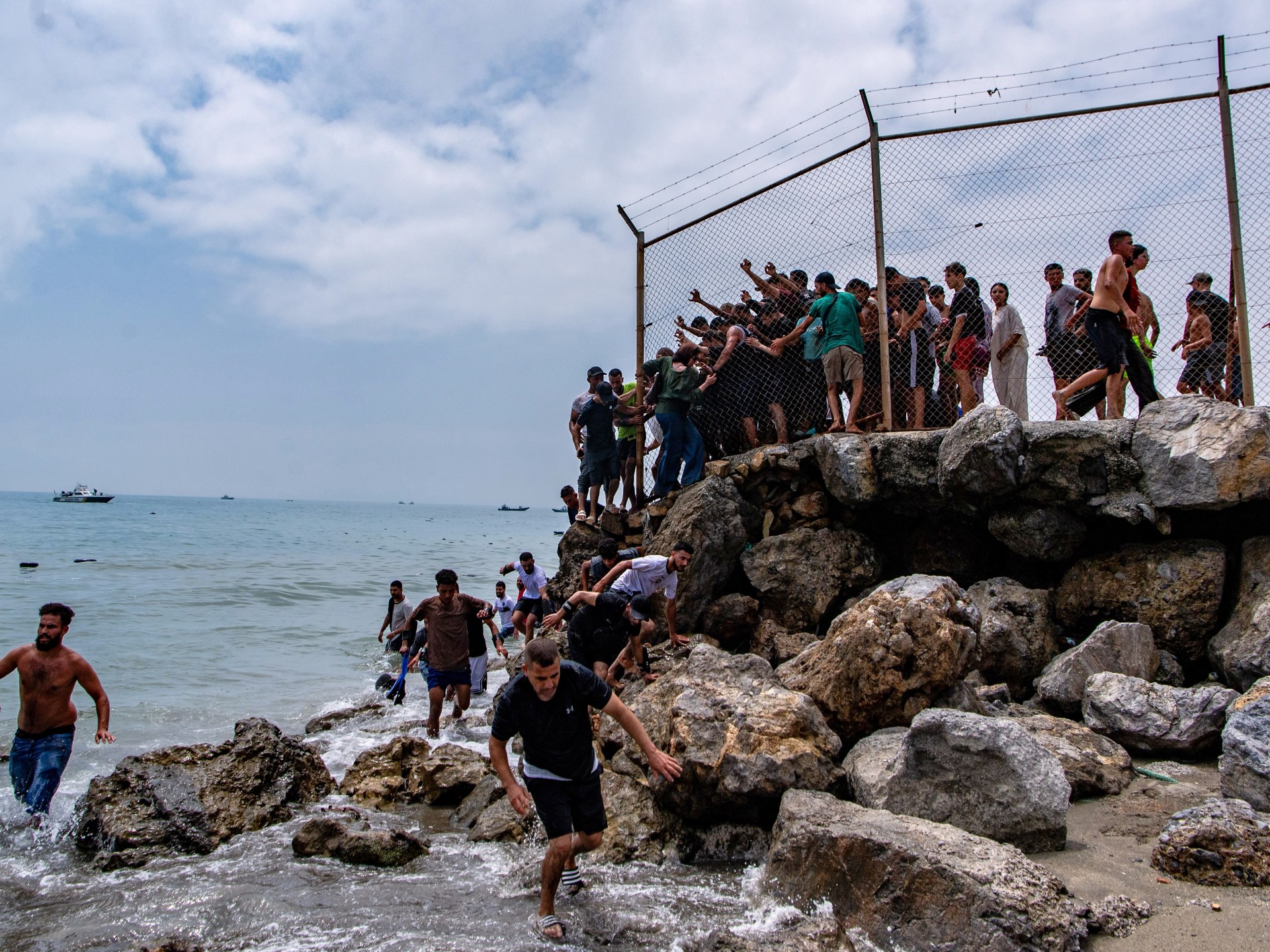 Spain’s enclave Ceuta raises alarm as thousands cross border from Morocco