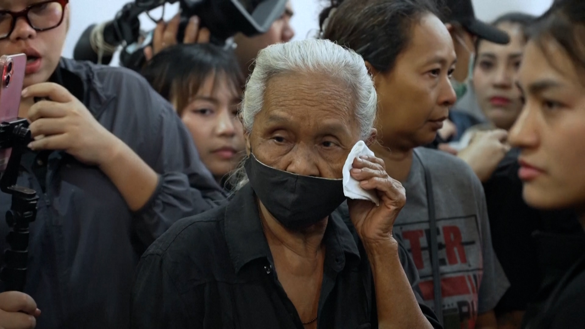 Families claim bodies of victims of deadly Bangkok pub fire