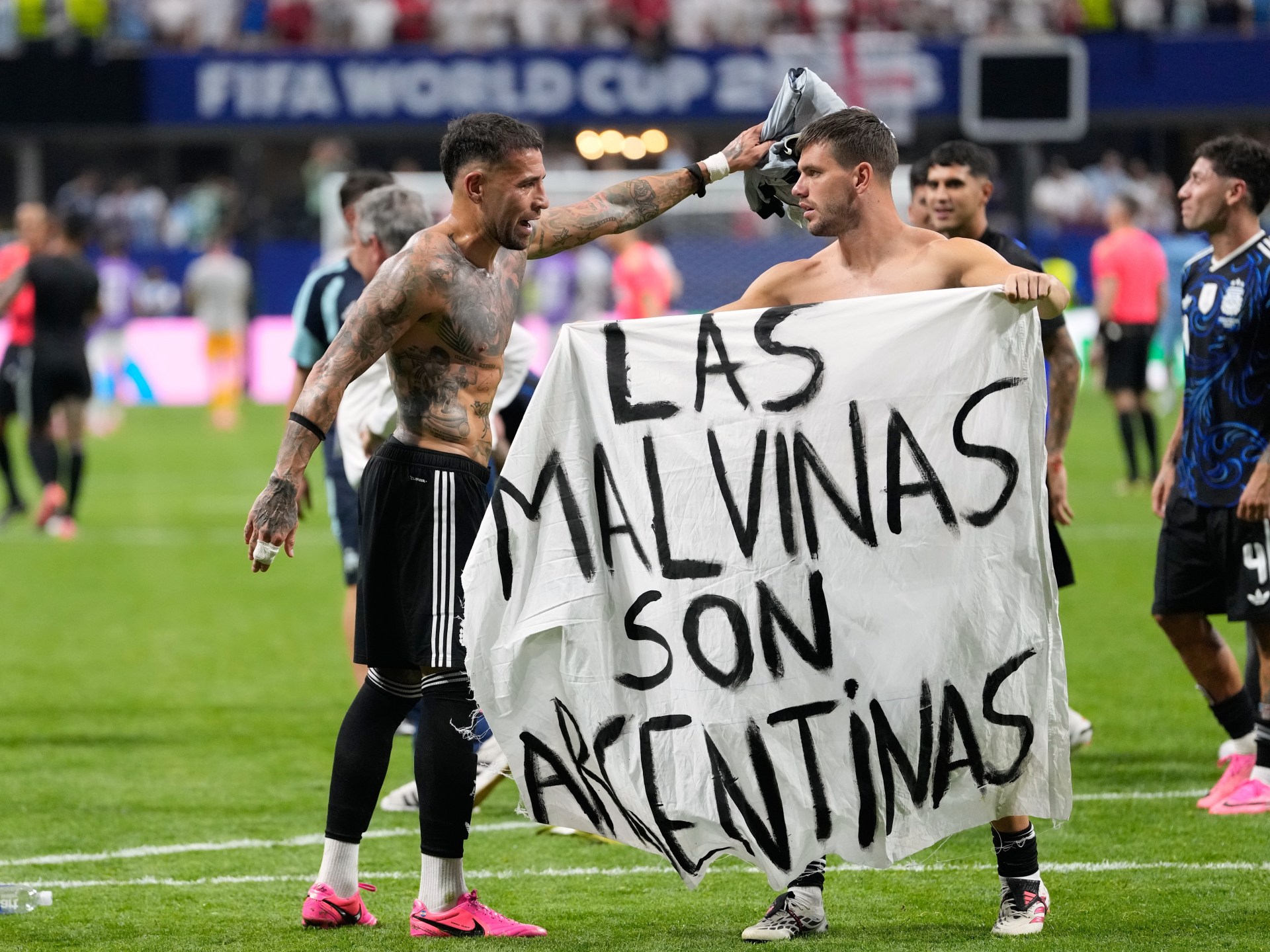 Argentina players brandish political Falklands flag after England match