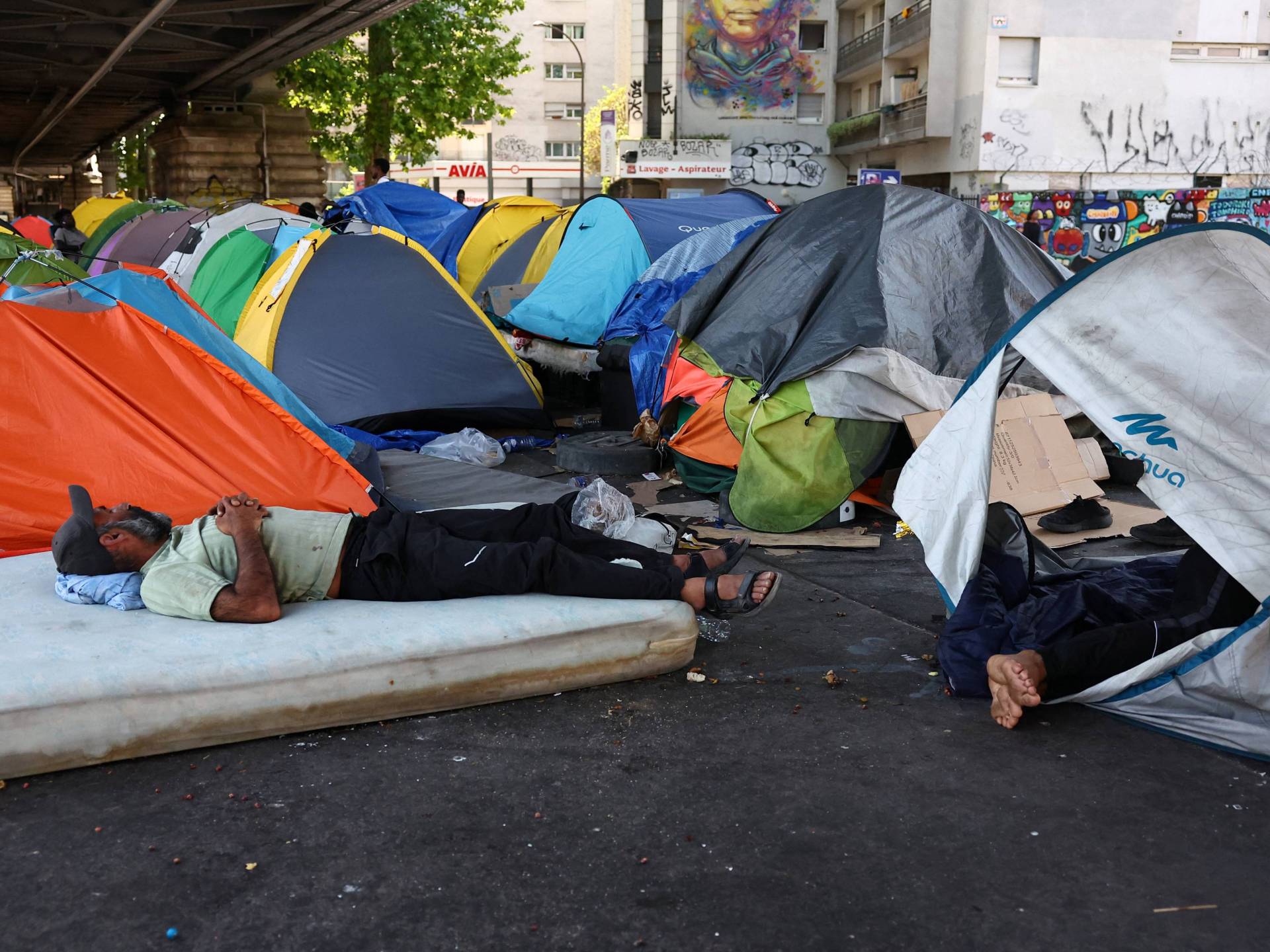 Migrants left to endure deadly Paris heat with little shelter or aid