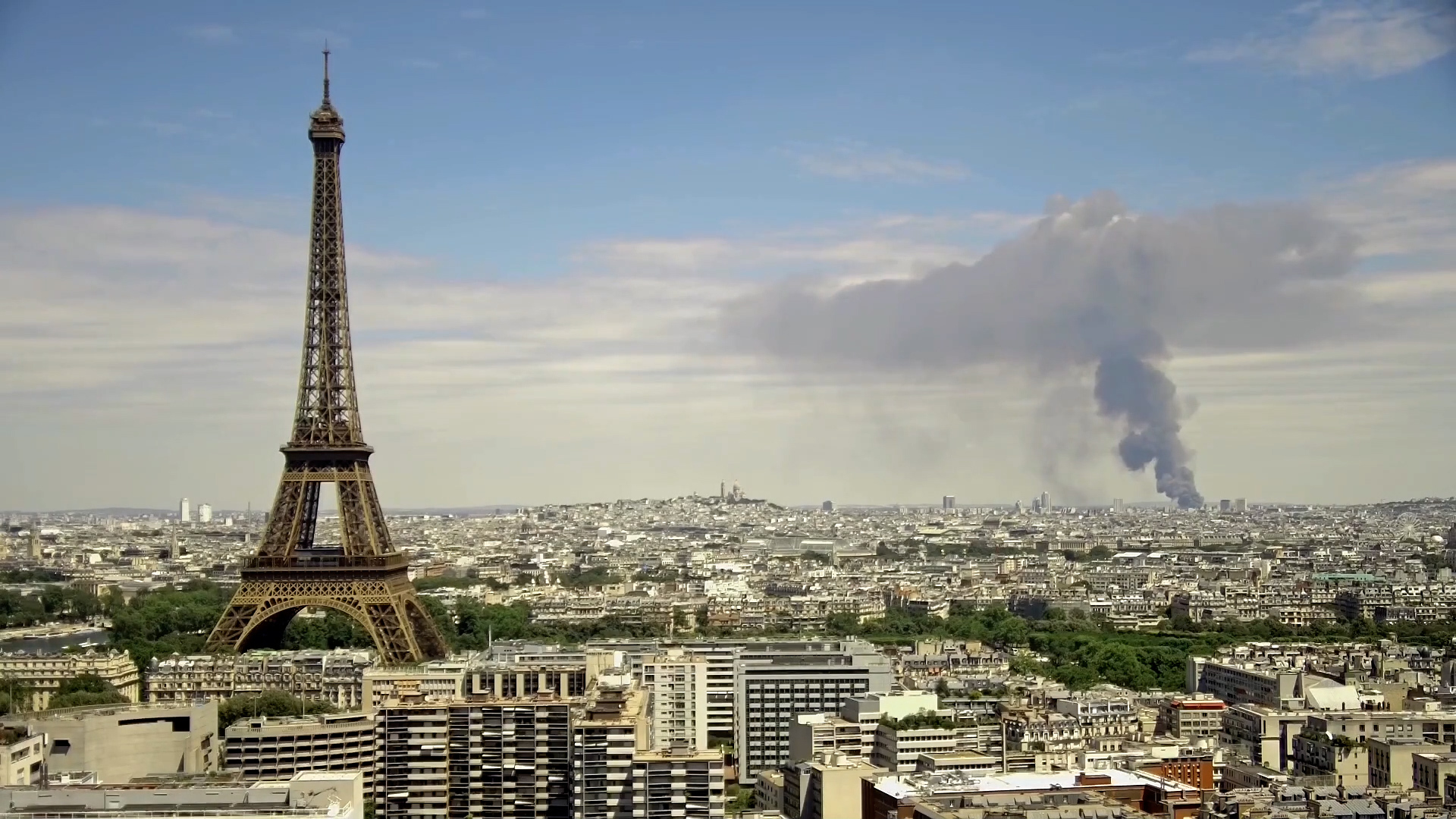 Thick black smoke towers over Paris skyline after warehouse blaze