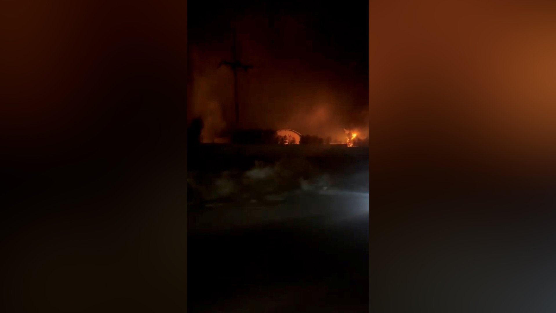 Air defences activate in Iran and flames rise from US attacks