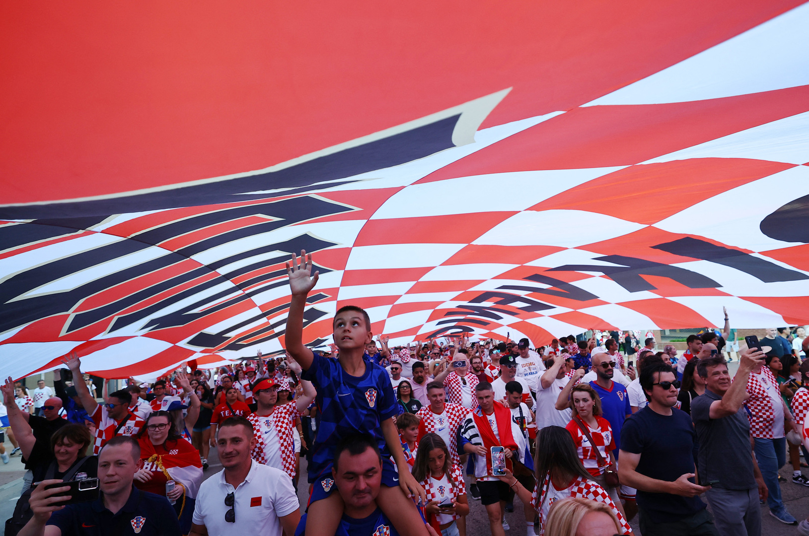 Croatia fans rock cowboy style in Dallas parade ahead of match with England