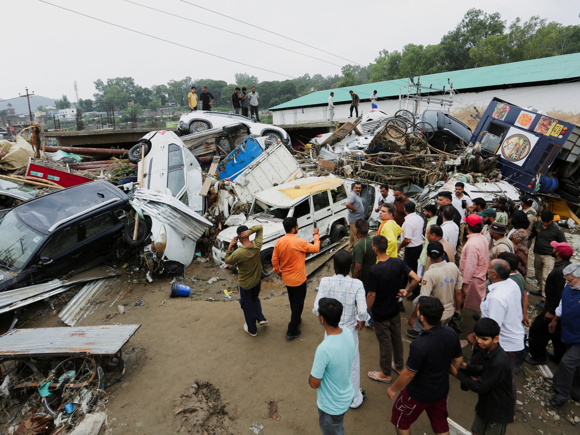 At least 25 killed as floods and landslides hit northern India