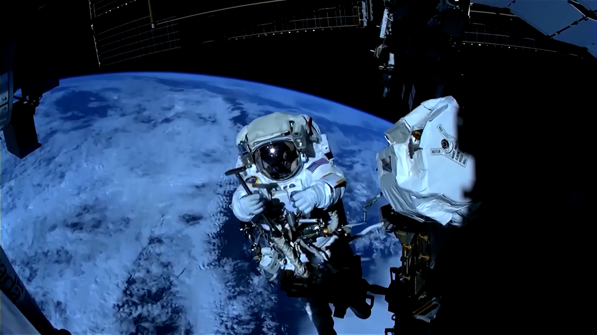 NASA astronauts spacewalk to fix robotic arm