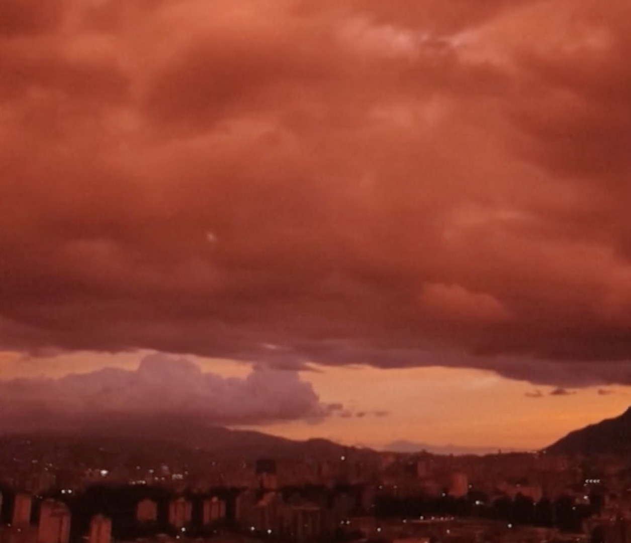 Venezuelan sky turns deep red as sun sets over Caracas